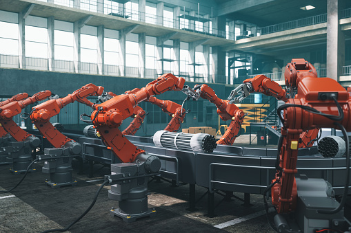 Trabajadores robot en fábrica photo