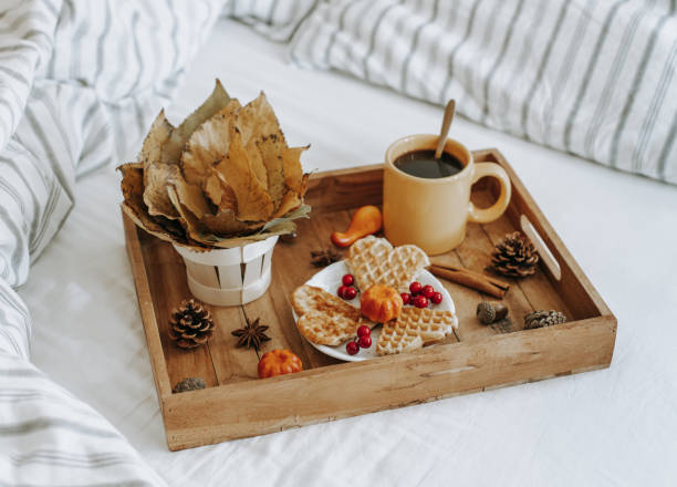istock Wooden tray with breakfast in bed. 1435427464