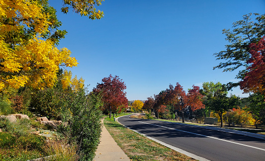 Empty residential curved street with autumn colors. Boulder, Colorado.