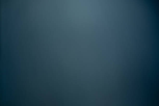 Dark black and blue blurred  gradient background has a little abstract light. stock photo