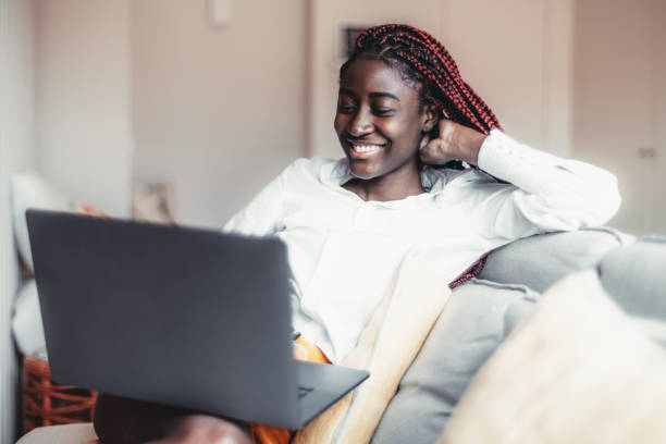 istock Black girl using laptop indoors 1435437220