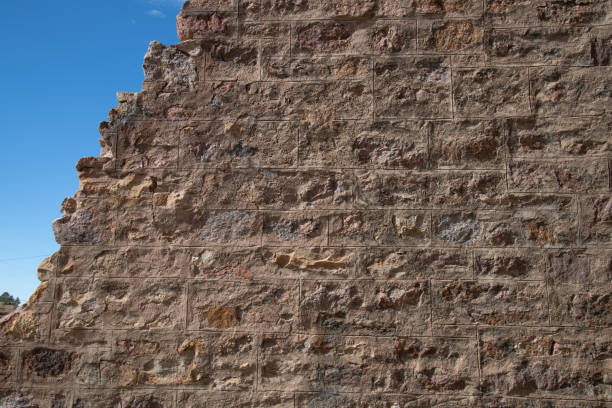 Old rough rugged stone wall or exterior structure from 1880s gold mining town in Colorado in the town of Victor in western USA of North America.
