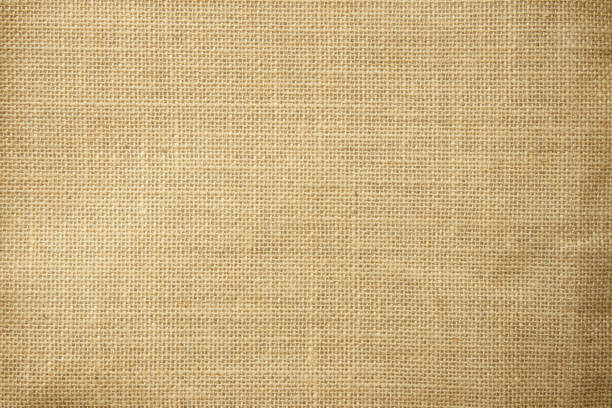 istock Jute hessian sackcloth burlap woven, linen texture pattern background in light beige cream brown color blank. Natural weaving canvas fiber line cotton cloth textured as clean organic for decoration. 1435445154