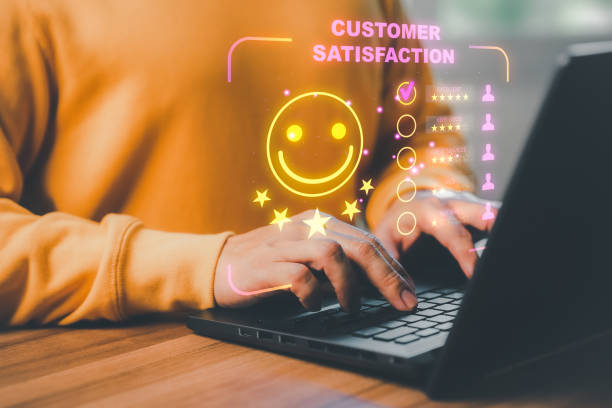 istock Man hand using computer laptop with popup five star icon for feedback review satisfaction service, testimonial. Customer service experience and business satisfaction survey. 1435453708