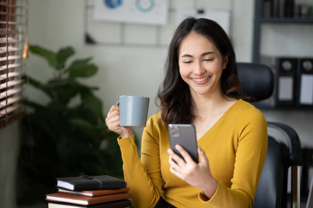 istock Woman working on the mobile phone in the office 1435454962
