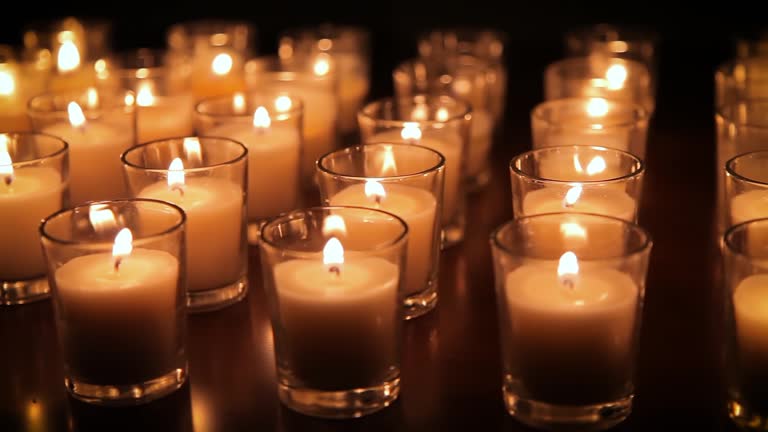 Rows of candles in a church or temple.