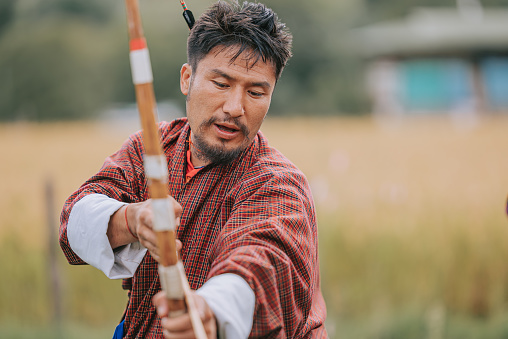 Bhutanese Man preparing in Archery field