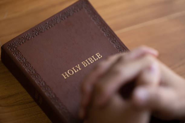 istock Holy Bible on wood in natural light. 1435457305
