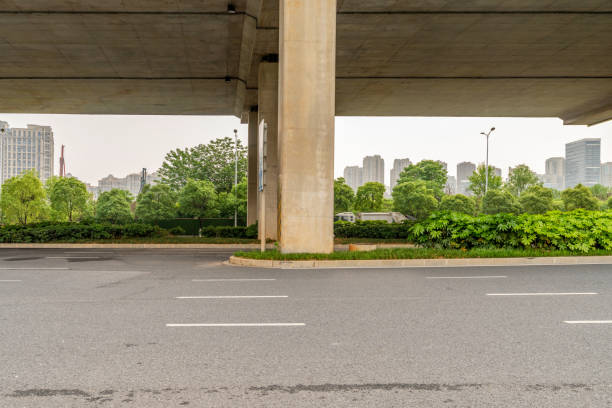 istock Concrete structure and asphalt road space under the overpass in the city 1435457765