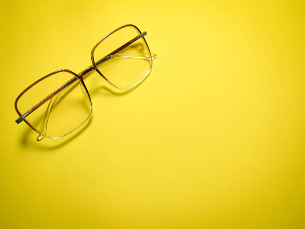 istock clear glasses on a yellow background  copy space 1435461984