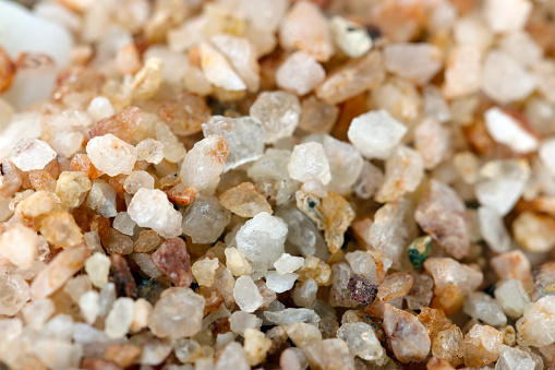 Quartz sand (Amber quartz) gravel with a sense of transparency texture. Close-up macro photography.