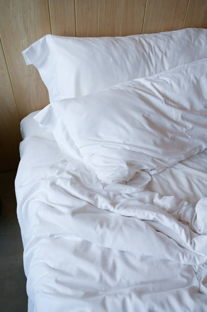 istock white bed and pillows in the room 1435481545