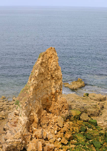 istock rock collapsed due to erosion due to wave motion 1435484258