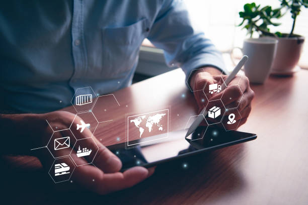 istock Man using portable table touch device with stylus. Logistics and supply chain icons and illustrative concept 1435484408