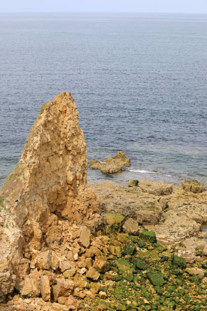 istock rock collapsed due to erosion due to wave motion 1435484476