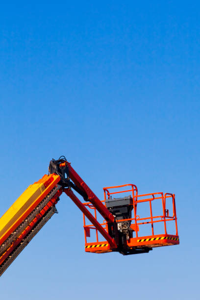 istock Colorful cherry picker, clear blue sky. 1435490578