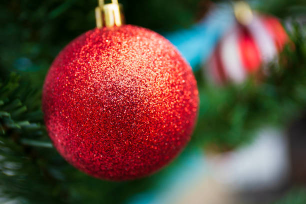 Red balls decorated on the Christmas tree.