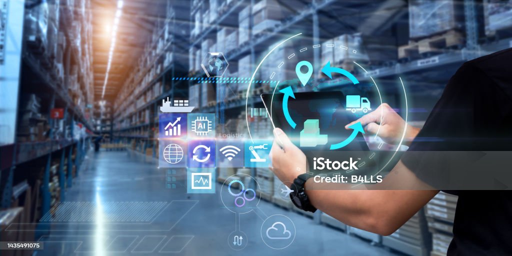 Business Logistics technology concept. Man hands using tablet on blurred warehouse as background Freight Transportation Stock Photo