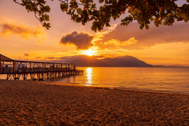 istock Sunset on beach with pier and quiet ocean in Florianopolis, Brazil 1435492657