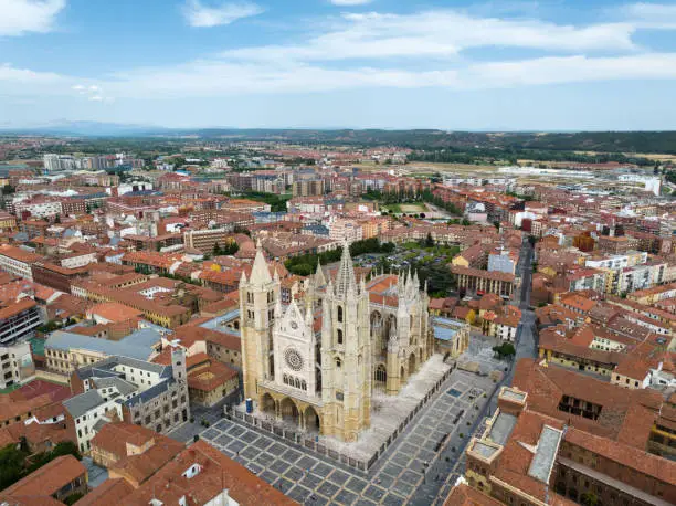 León City View in Summer with old gothic Santa María de Regla de León Cathedral from 13th Century in the downtown city center. Aerial Drone Point of View. Leon Cathedral, León, Castile y León, Spain, Europe