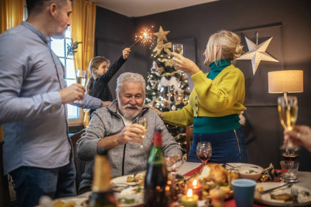 istock multigeneration family toasting during New years dinner at home 1435499002