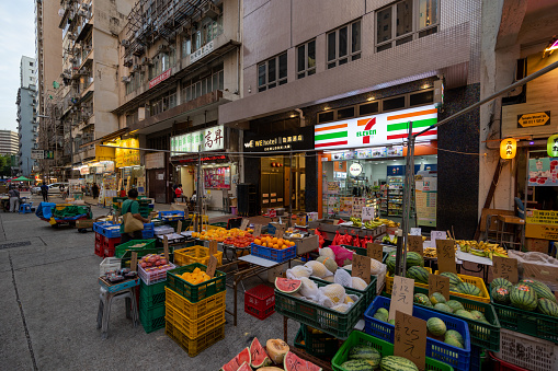 Hong Kong - October 20, 2022 : Fruit store at the Temple Street Market in Yau Ma Tei, Kowloon, Hong Kong.