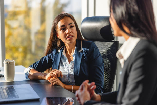 istock Two Hispanic Female Executives Discussing Future Plans and Ideas In The  Head Office 1435504091