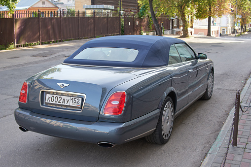 Nizhny Novgorod, Russia - September 04, 2022: A grey Bentley Azure car parked on street.