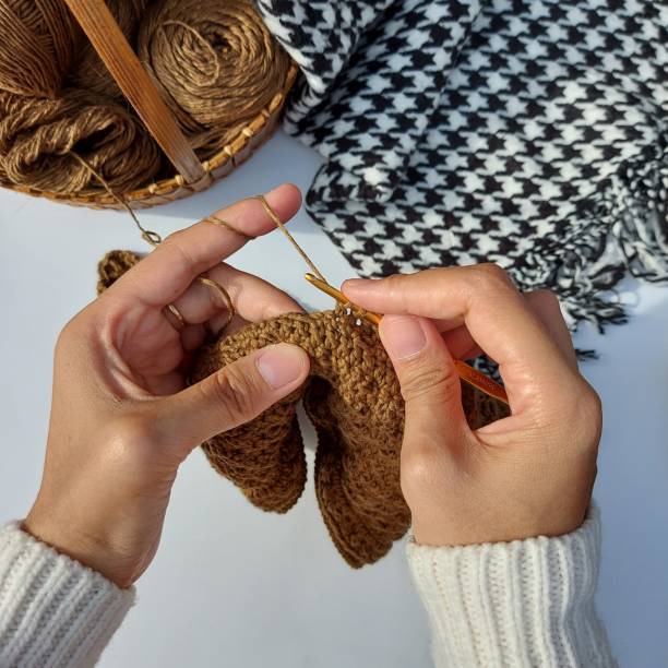 istock woman hands is crocheting 1435513915