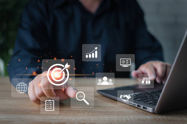 istock Business development and management Executives looking at virtual screens, Businessman use laptops in business work, business graph icon Goal setting in hand for effective management 1435514867