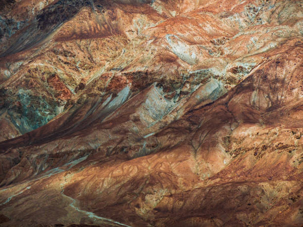 istock Stone texture on a mountain face with sun light. Shadows and Highlights. 1435517002