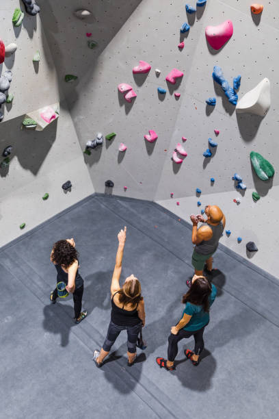 istock Group of young people training rock climbing with instructor 1435517073