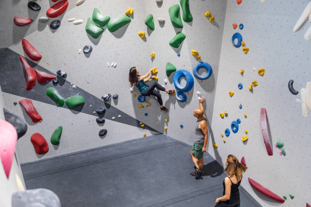 istock Sportspeople practicing in indoor climbing center 1435517100