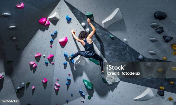 Sportswoman Training Climbing On Indoor Climbing Wall Stock Photo - Download Image Now