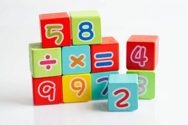 Photo of Number wood block cubes for learning Mathematic, education math concept.