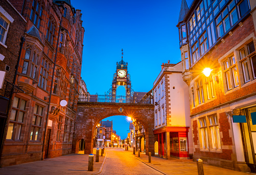 Chester Eastgate clock tower arch at sunset dusk in England UK United Kingdom. Is an open gate from the roman fortress