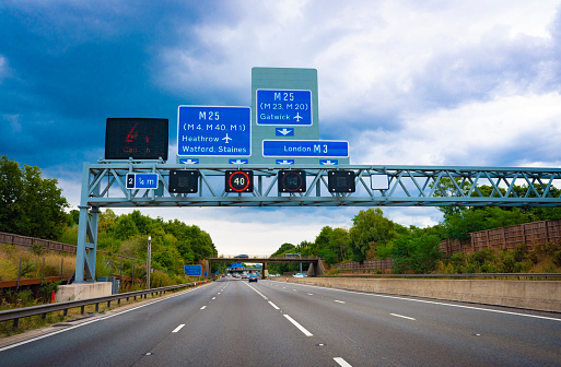 London M3 & M25 Motorway traffic road signs to airports Gatwick and Heathrow in England UK United Kingdom