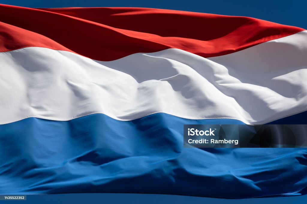 Flag of the Netherlands full screen close-up Flag of the Netherlands waving in the wind Allegory Painting Stock Photo