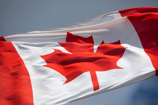 Canadian flag waving in the wind