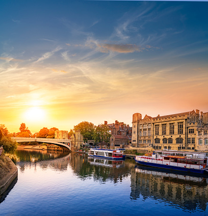 York UK Guildhall sunset in Lendal Bridge over river Ouse boats in England United Kingdom of North Yorkshire