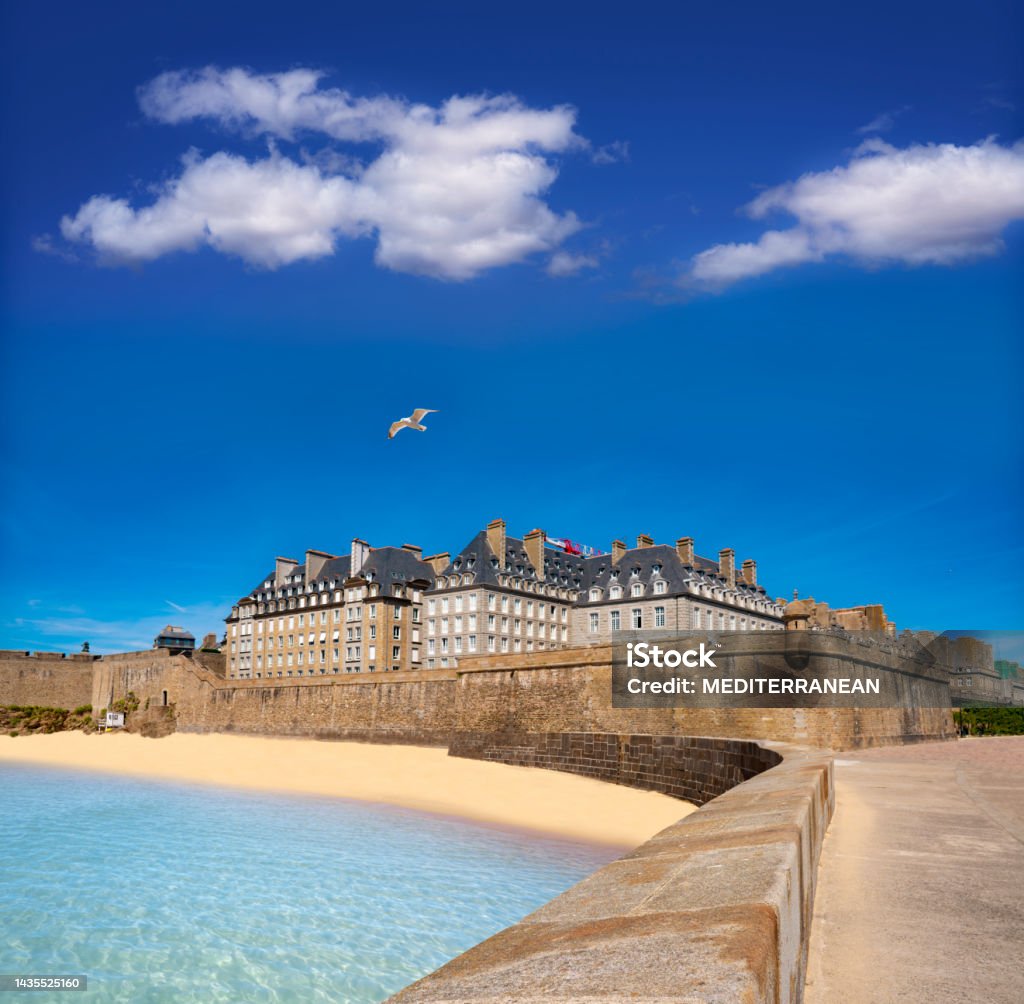 Saint-Malo Plage du Mole beach and fortress in french Brittany of France Saint-Malo Plage du Mole beach and fortress in french Brittany of Ille et Vilaine Bretagne of France, known for its walled city since the 13th century. Brittany - France Stock Photo