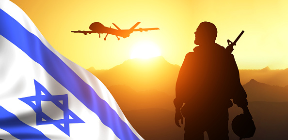 Silhouette of Soldier in sky background . Flag of Israel. National holiday .