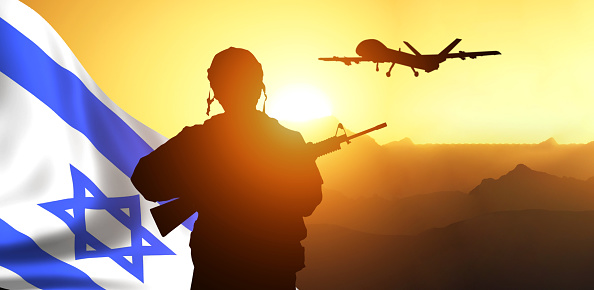 Silhouette of Soldier in sky background . Flag of Israel. National holiday .
