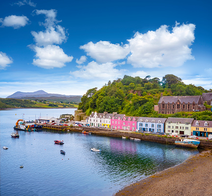 Skye island Portree Harbour colorful houses in Highlands Scotland UK in United Kingdom. The pier was designed by the engineer Thomas Telford