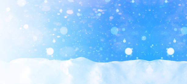 istock snowflakes snow blue sky - winter background banner long 1435539641