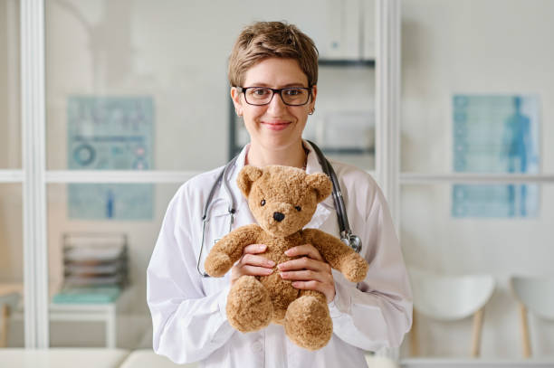 istock Female pediatrician with toy at office 1435539879