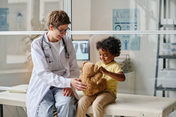 istock Pediatrist talking to her little patient 1435539892