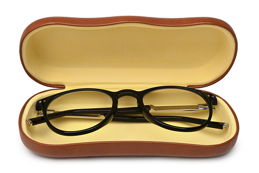 Glasses in case on white background