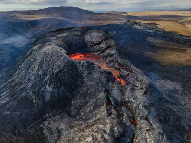 istock Lava flows from volcanic craters with incipient eruption 1435543028