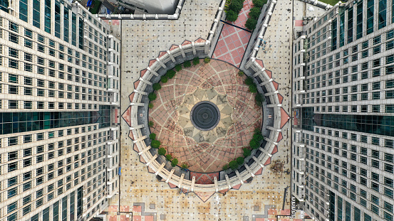 aerial top down view of a courtyard between two high rise buildings.
